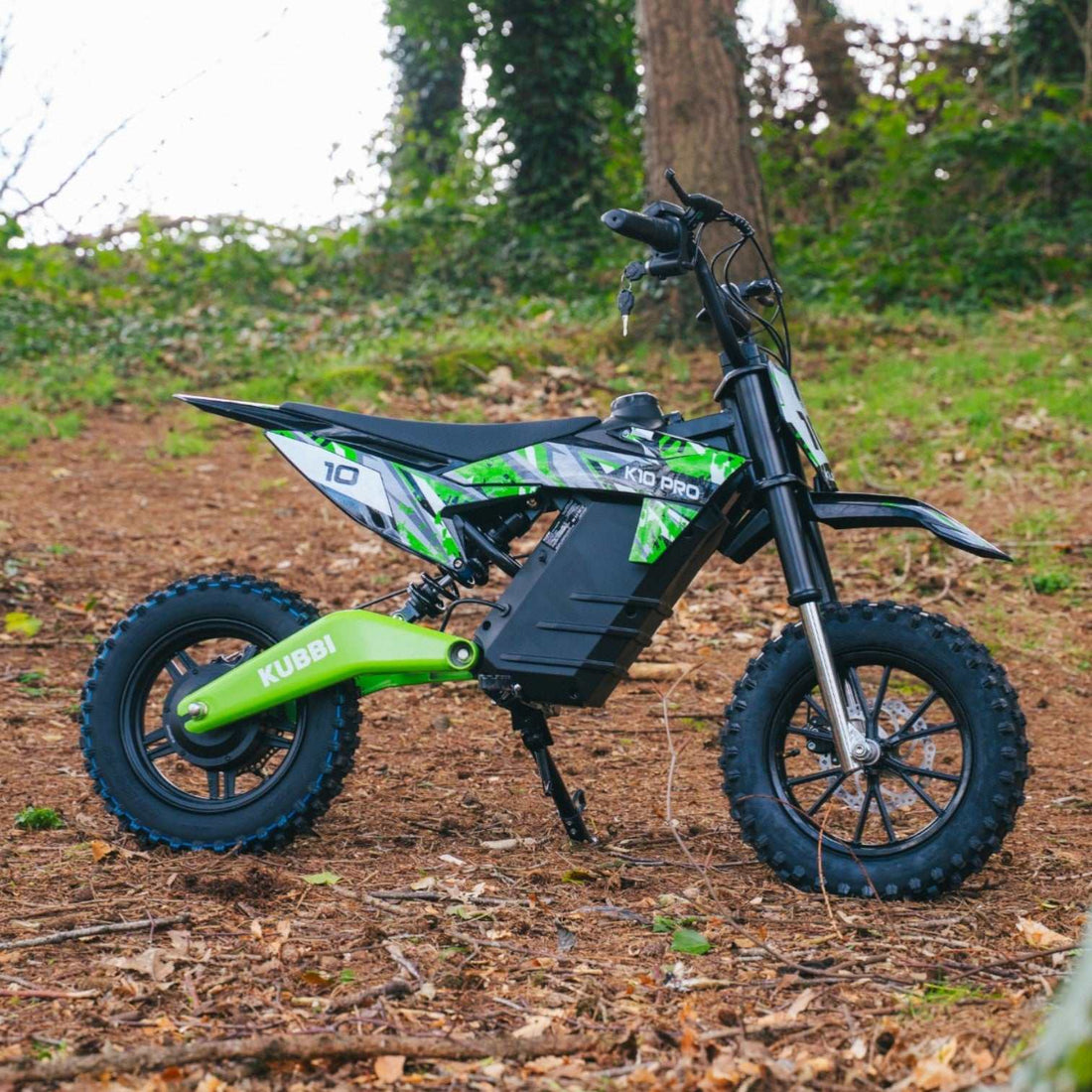 Kid riding a Kubbi K10 Pro electric dirt bike on private land off-road in the UK