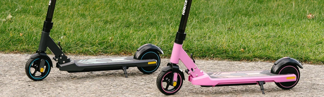 Kubbi kids electric scooters in black and pink, side by side