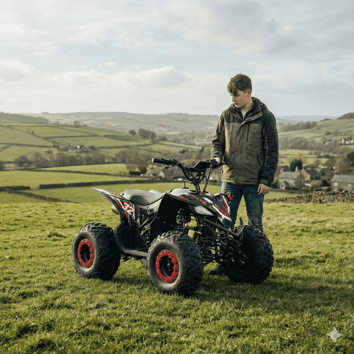 Teen with Kubbi Q32 Quad electric 2500W quad bike in grassy field