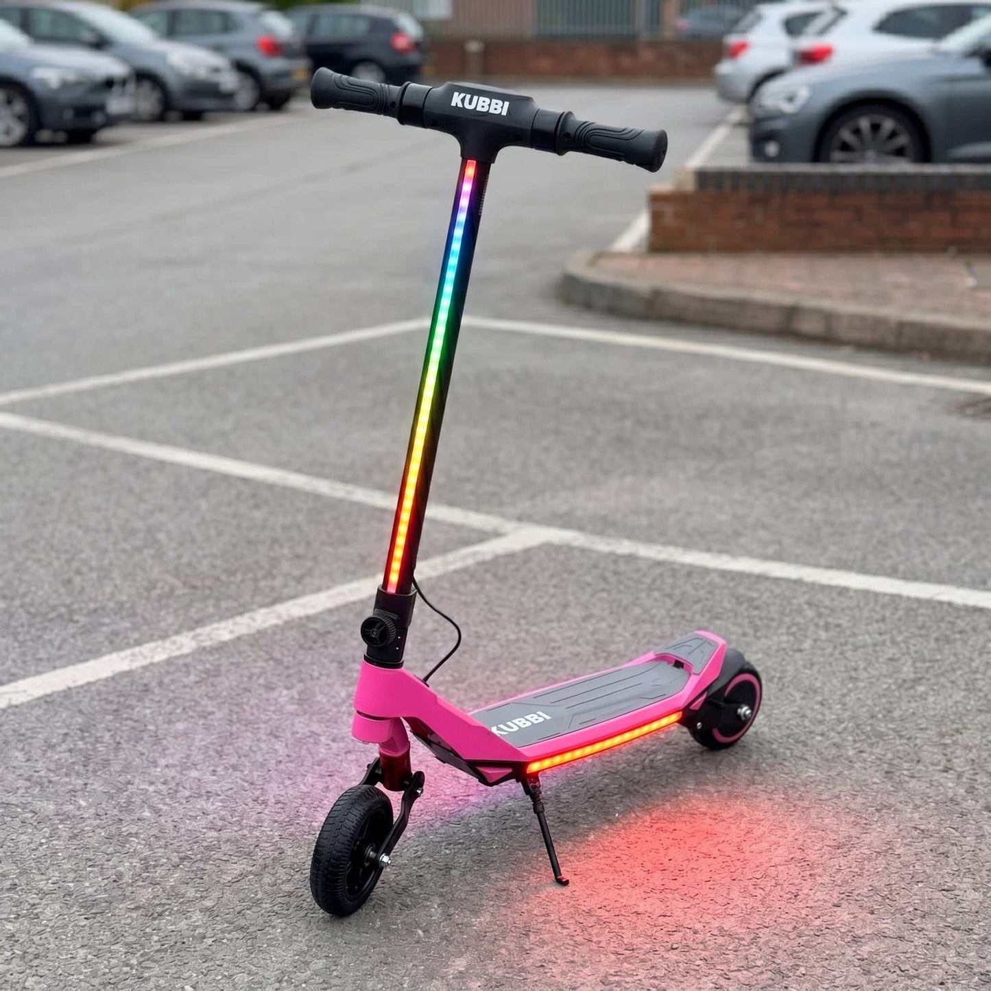 Kubbi S7 Pro junior off-road electric scooter for kids with LED display and suspension in black, pink, and blue.