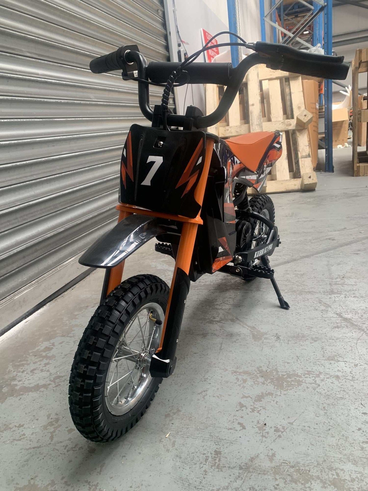 Kubbi K7 Pro orange electric dirt bike in as-new condition, warehouse deal, never ridden